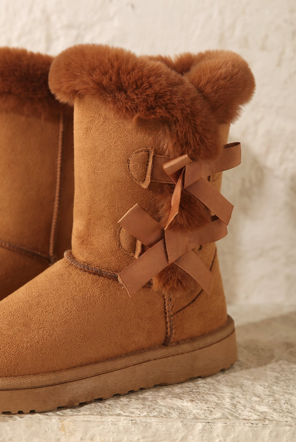 Women's Cozy Winter Boots with Bow Detail - detail closeup